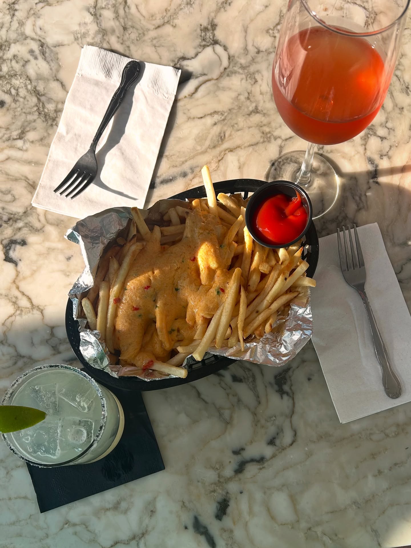 Drinks and pimento fries on the marble bar at Bar Arbolada