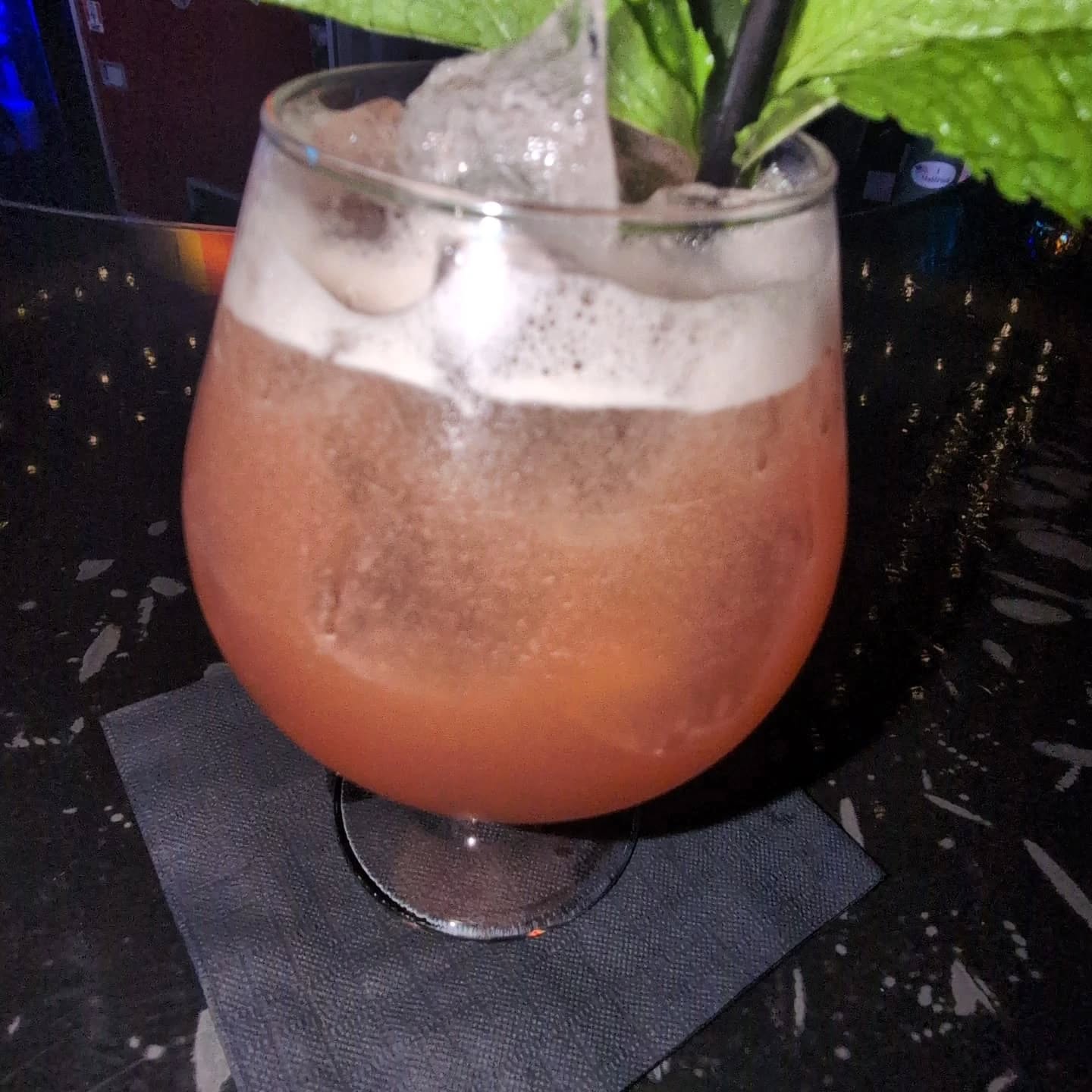 A signature pour at Lunar Lounge with fresh mint